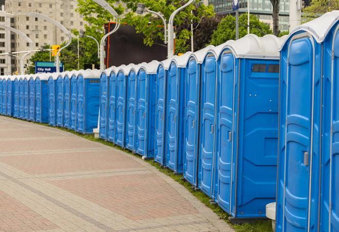 a row of portable restrooms at a fairground, offering visitors a clean and hassle-free experience in claude